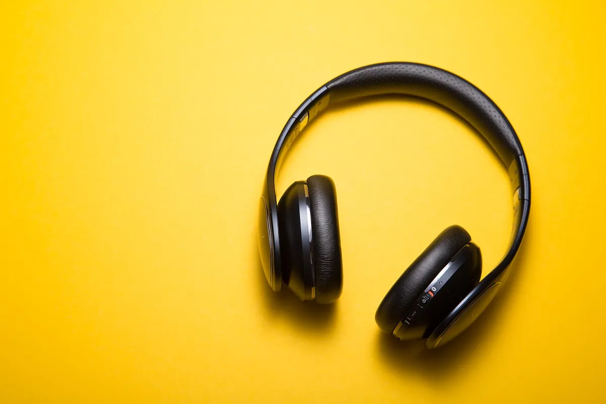 Over-ear headphones on a desk for a product comparison