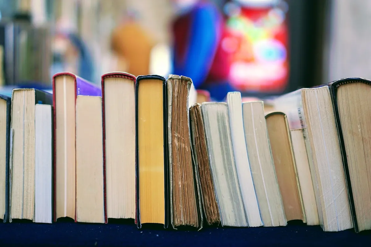 Book and reading notebook on a desk