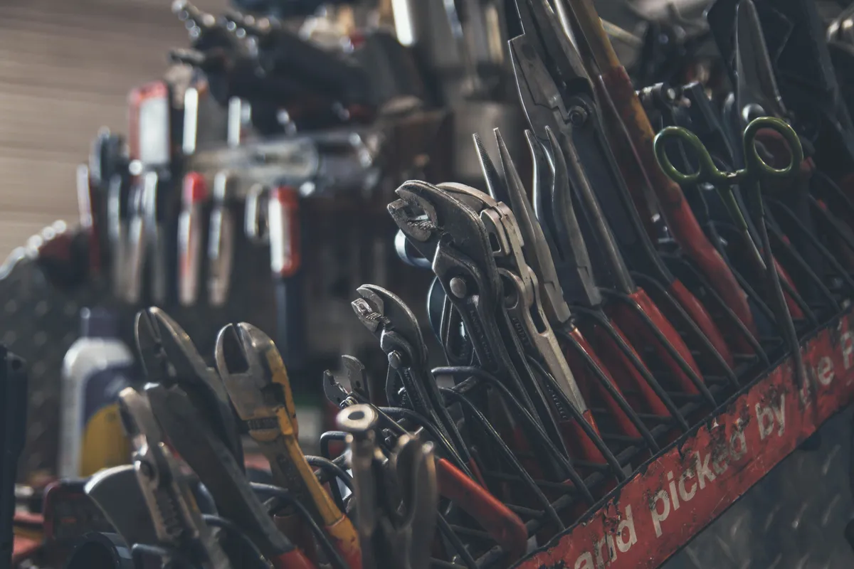 Power tools arranged on a workshop bench before a home project