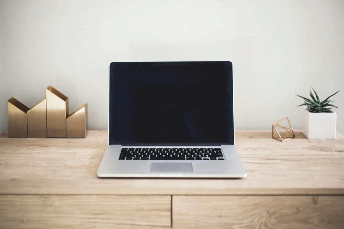 Laptop specifications being compared at a desk