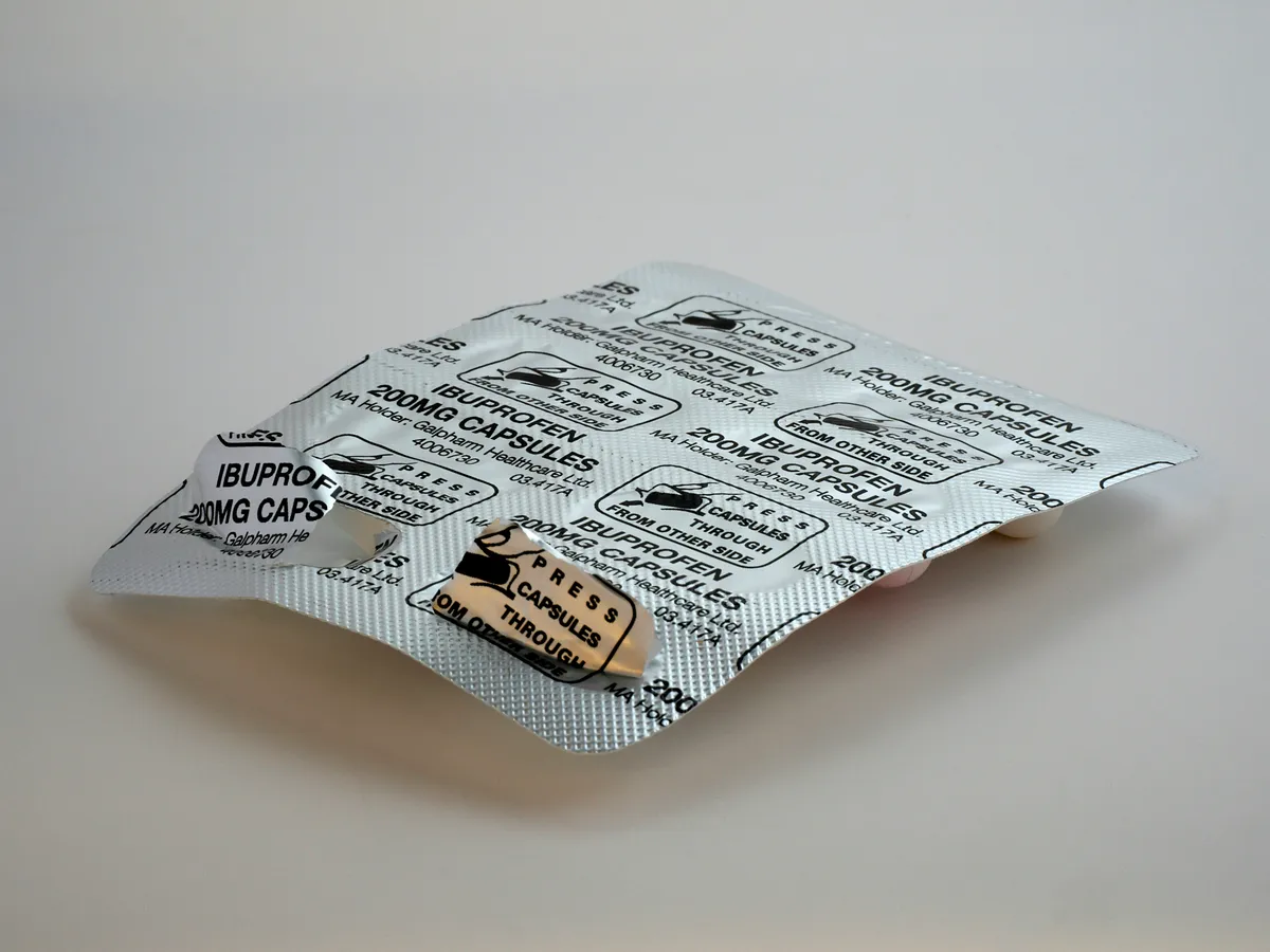 Supplement bottles and labels being reviewed before an online order