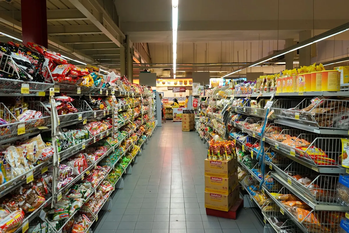 Person shopping in a grocery aisle