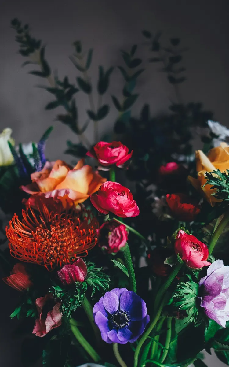 Flower arrangement in a vase for gift comparison