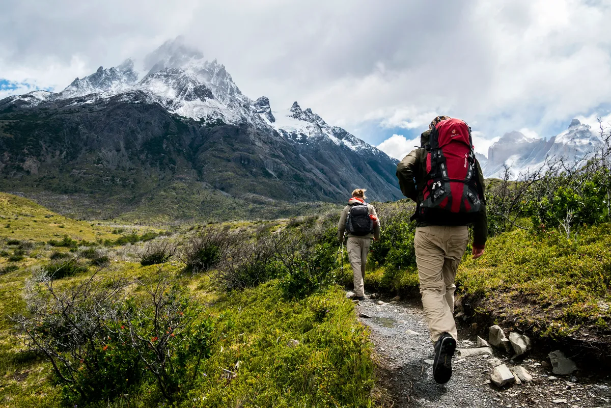 Outdoor layers and backpack prepared for a hiking trip