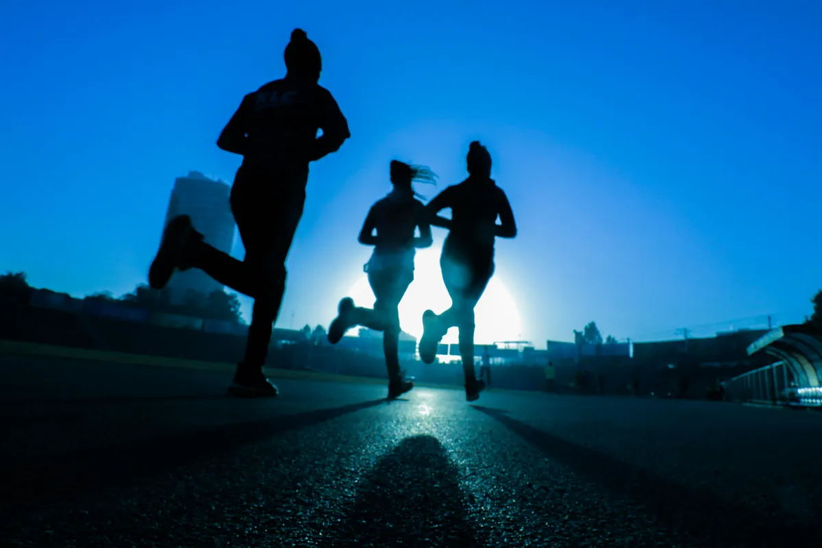 Runner reviewing smartwatch training data after a workout