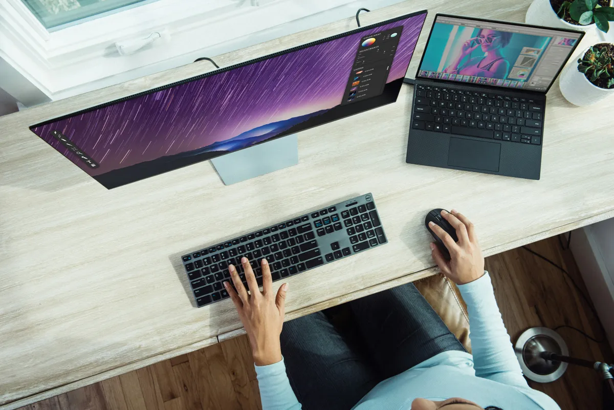 Multi-device workspace with laptop monitor keyboard and mouse