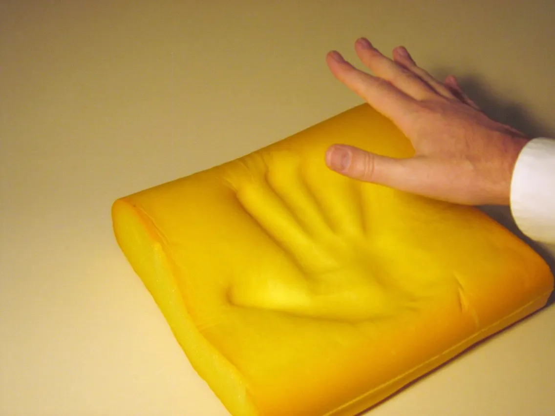 Memory foam slowly recovering its shape after compression