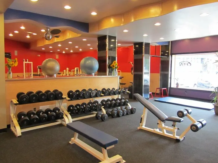 Free weights arranged on a rack