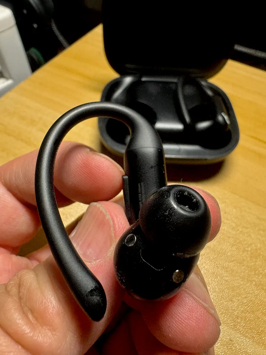 Sport-style wireless earbuds with ear hooks designed for workouts