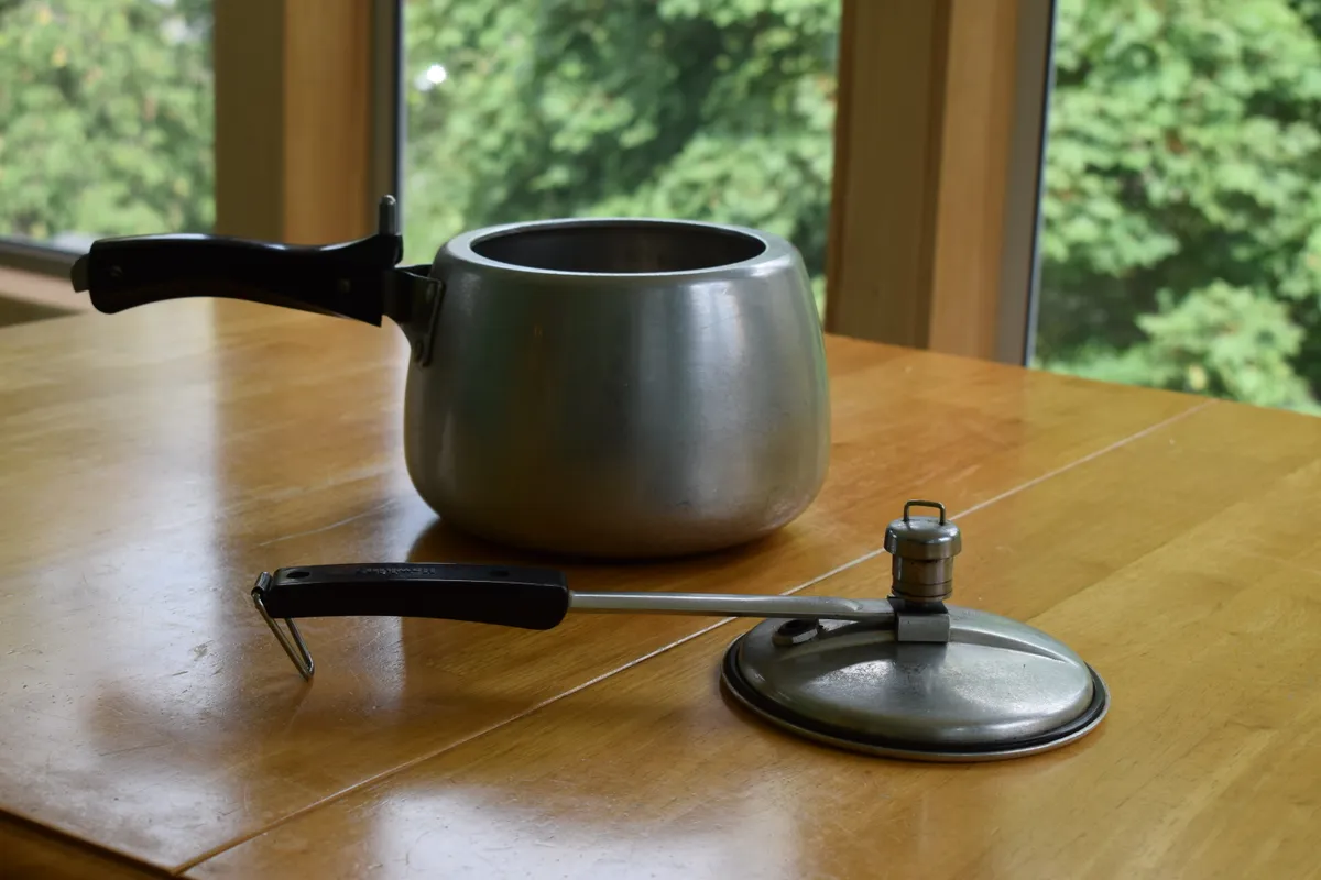A stovetop pressure cooker with a sealed lid