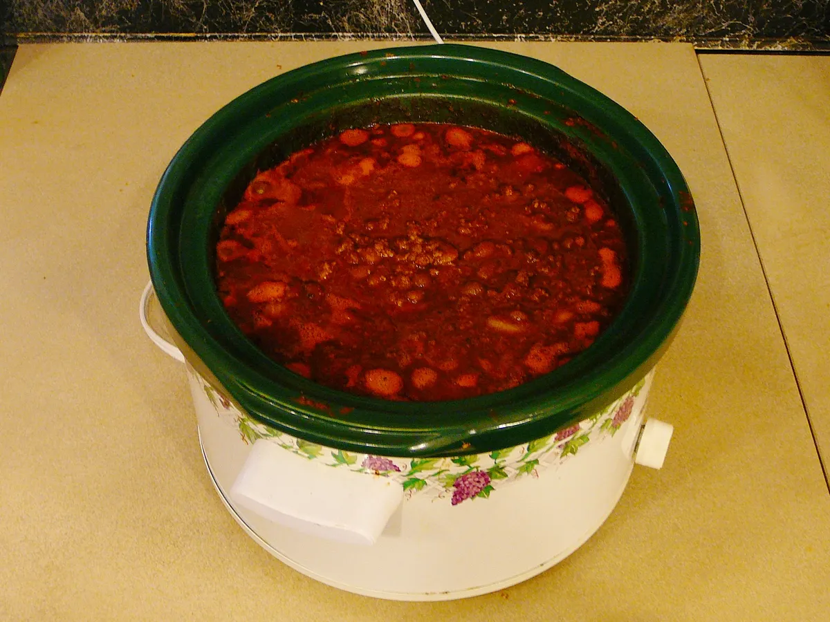Chili cooking in a slow cooker pot