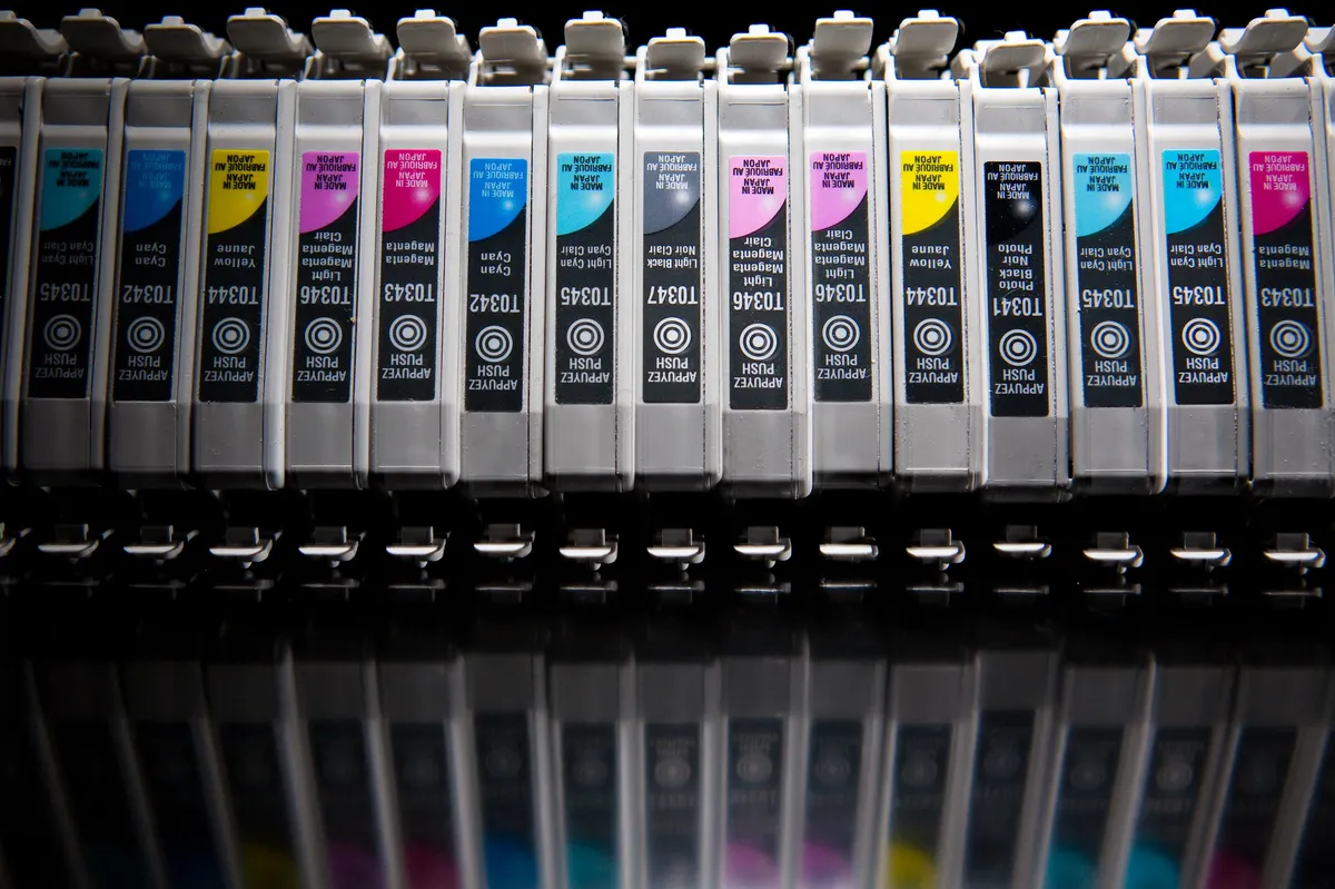 A row of used inkjet printer cartridges