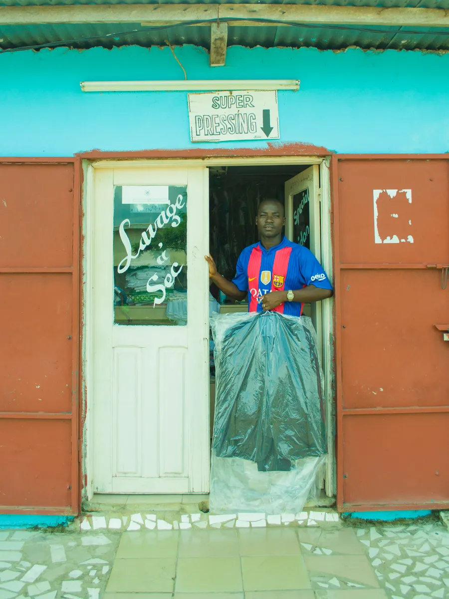A pressing and laundry service with irons in use