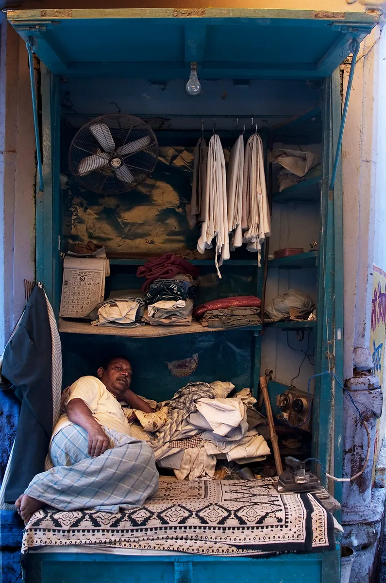 A laundry and ironing shop with pressed garments