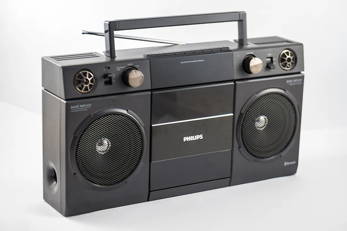 A wireless sound system unit on a shelf