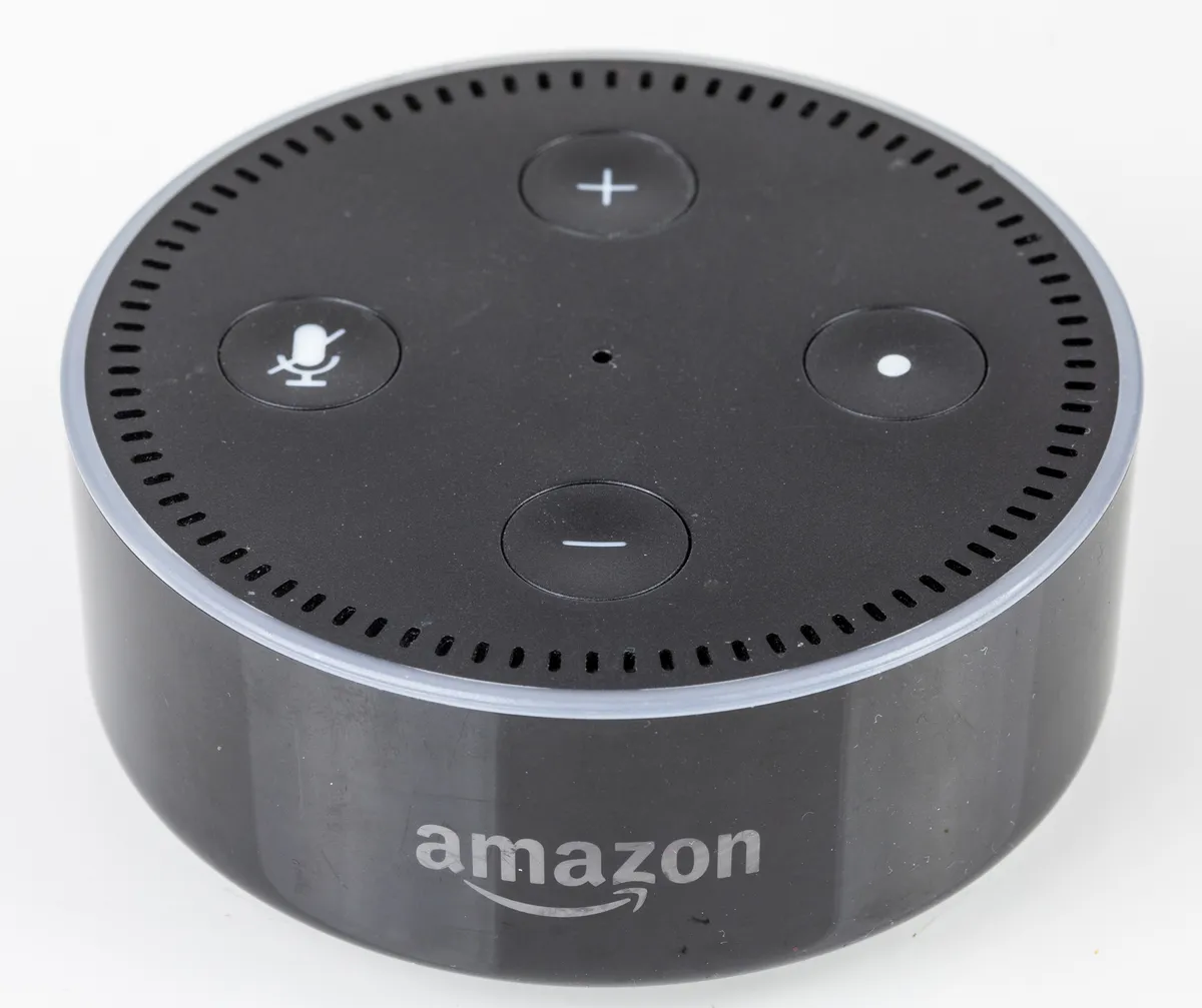 A compact smart speaker on a surface