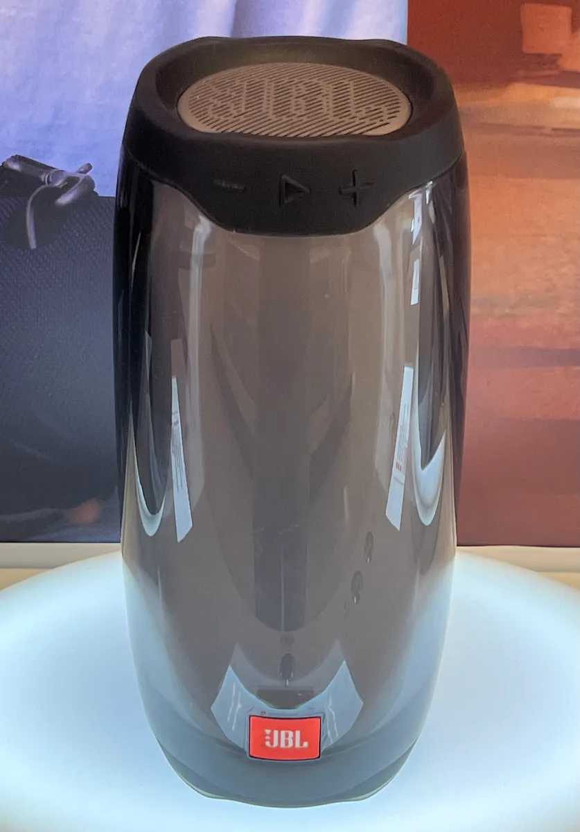A portable speaker with illuminated housing