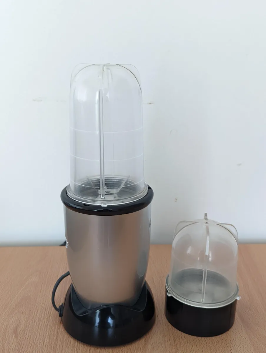 A table-top mixer grinder with multiple jars