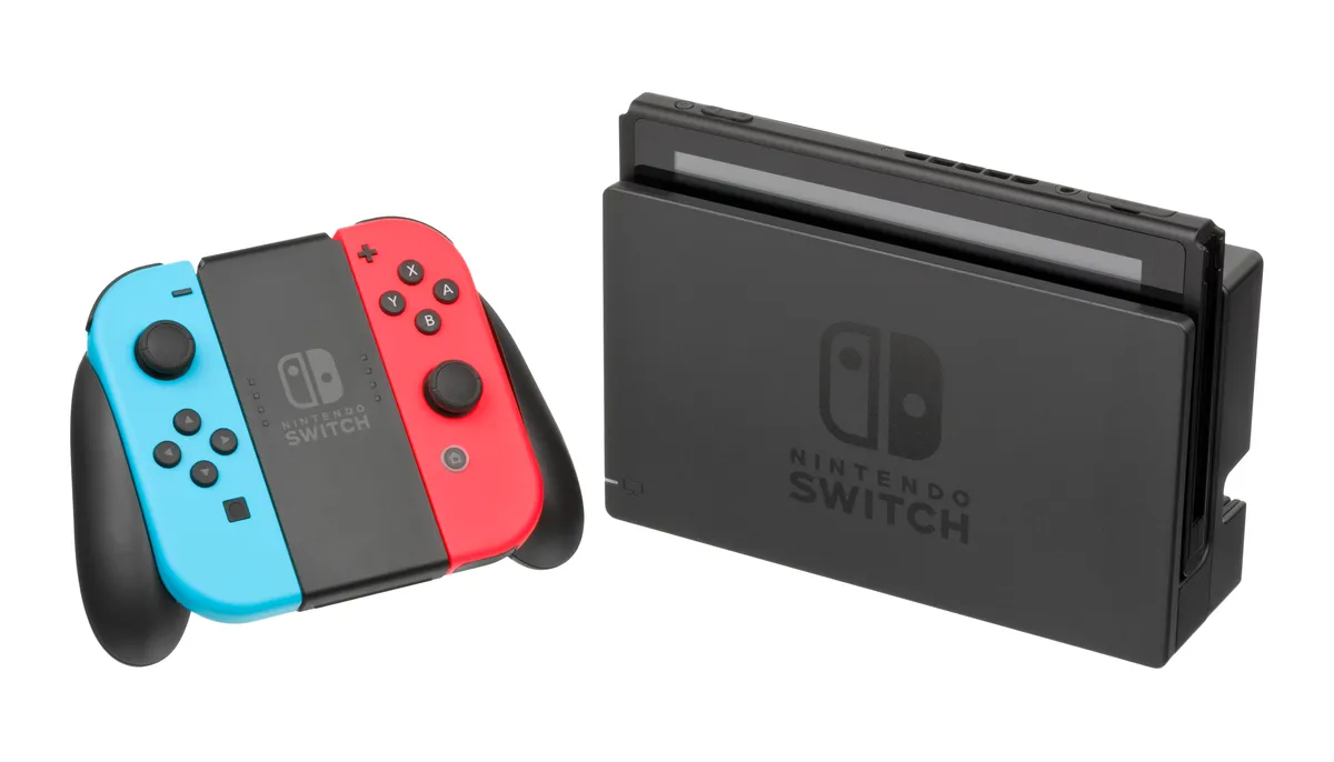 A handheld console sitting in a television dock