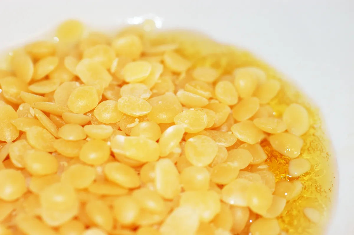 Beeswax being melted in a pan