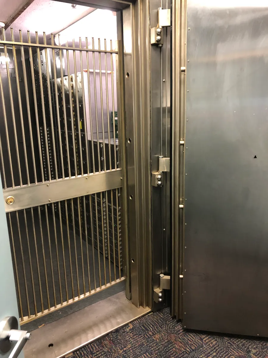 A wall of bank safe deposit boxes