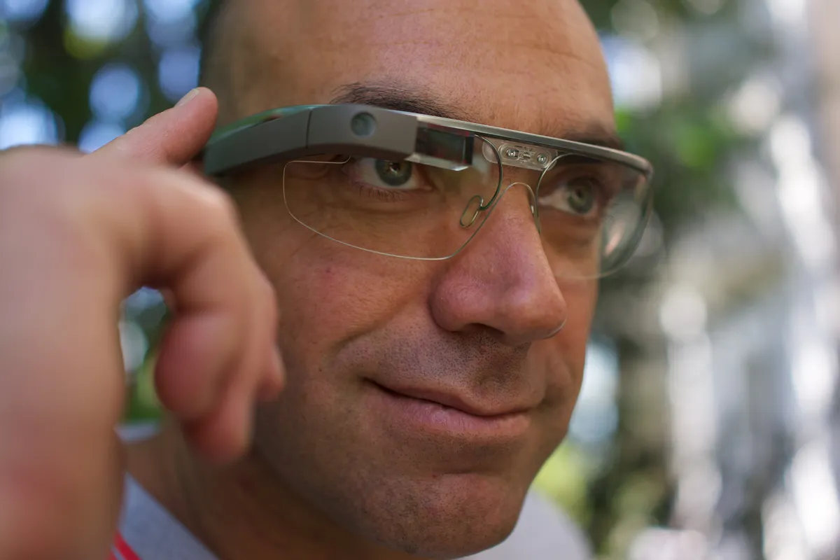 A person wearing early-generation smart glasses