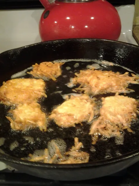 Food frying in a pan on a hob