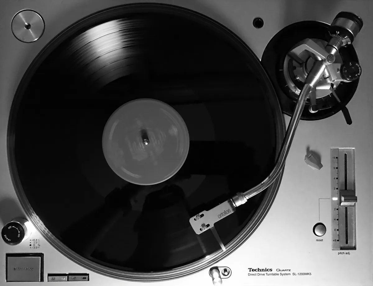 Technics SL-1200MK5 direct-drive turntable with Ortofon cartridge mounted on the tonearm