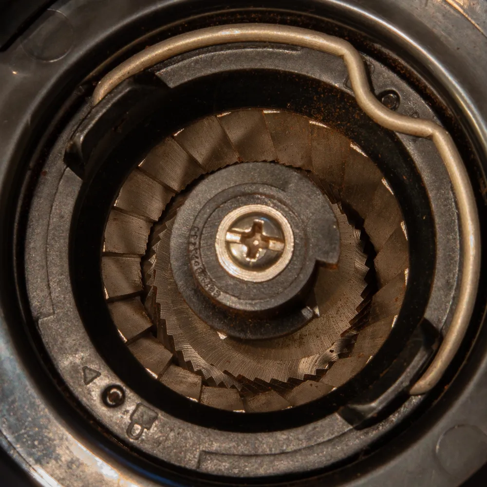 Close view of a conical burr grinder mechanism