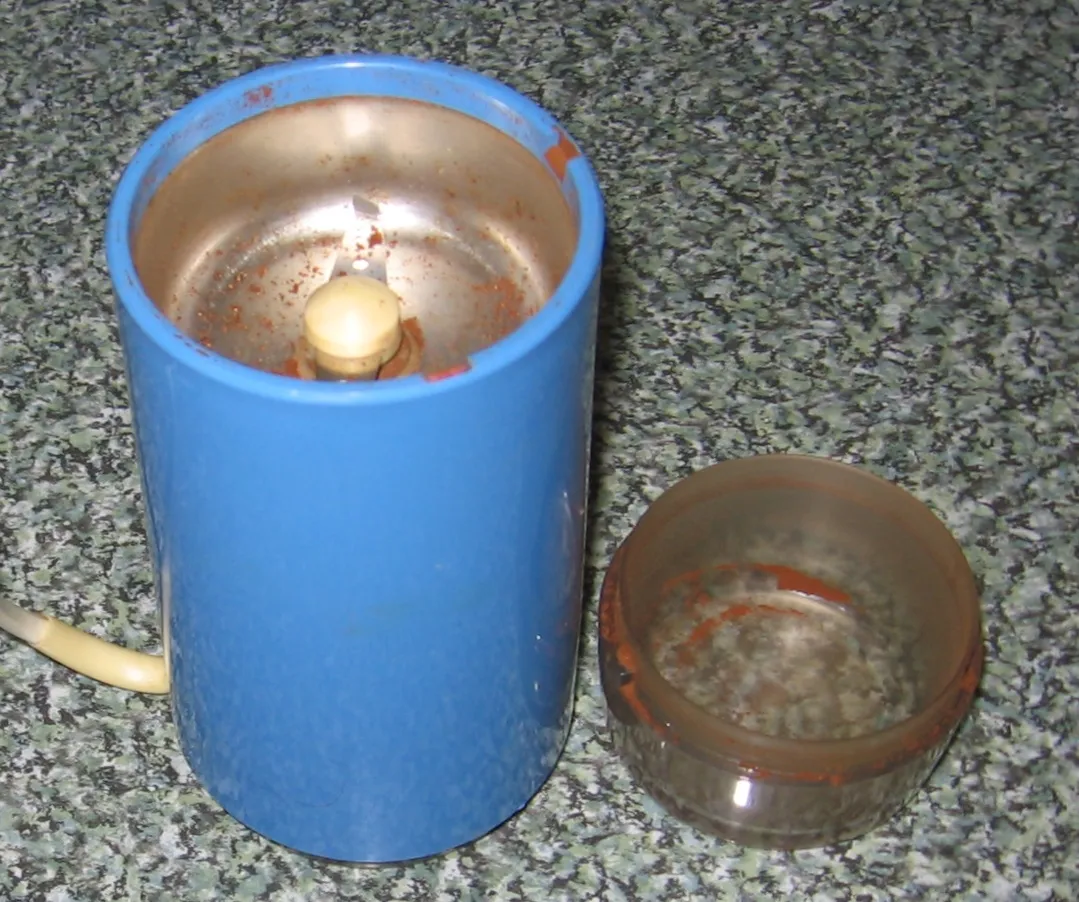 A traditional hand-cranked coffee grinder