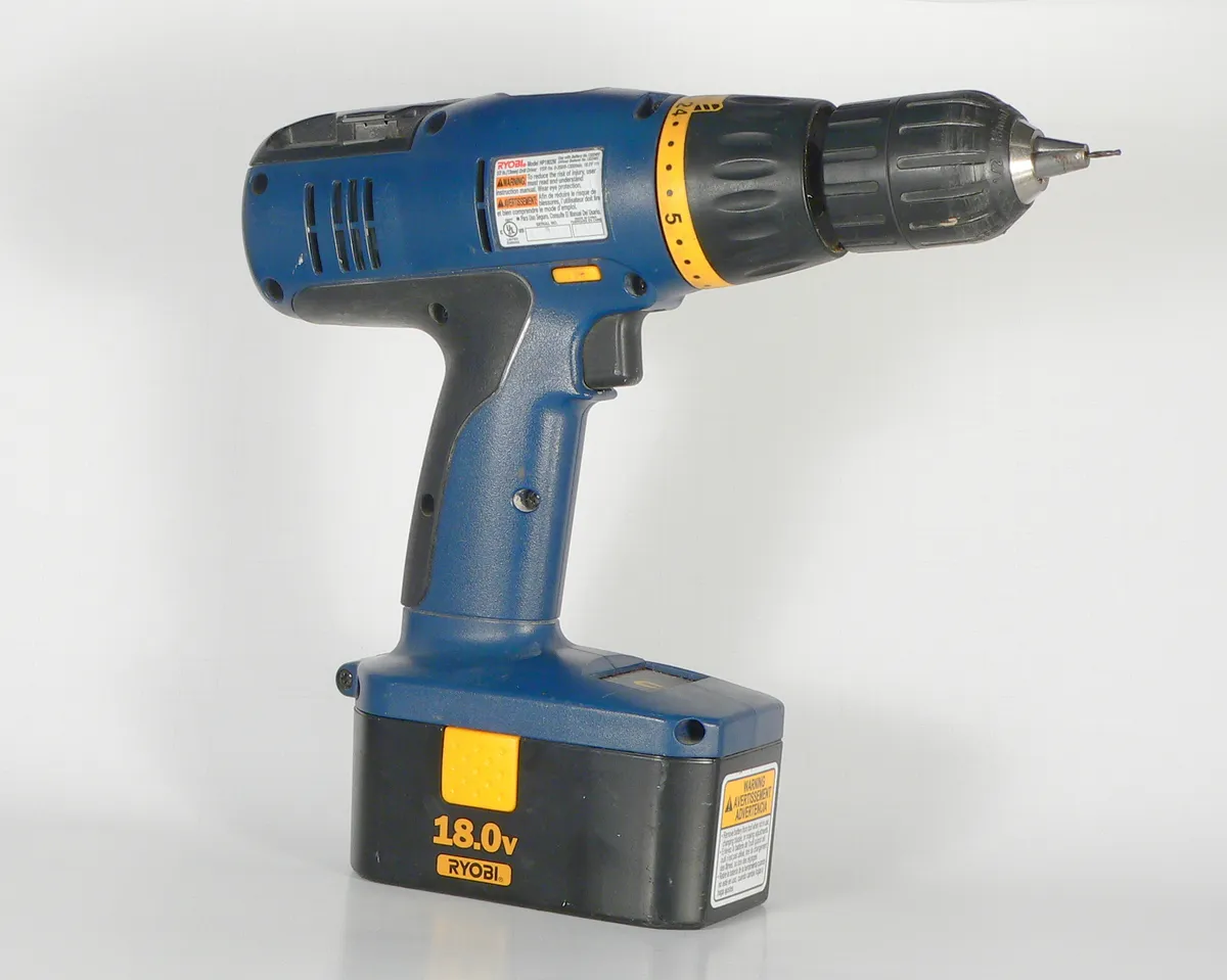 A cordless drill resting on a work surface