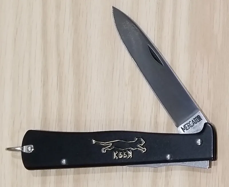 A slim folding knife with a steel handle
