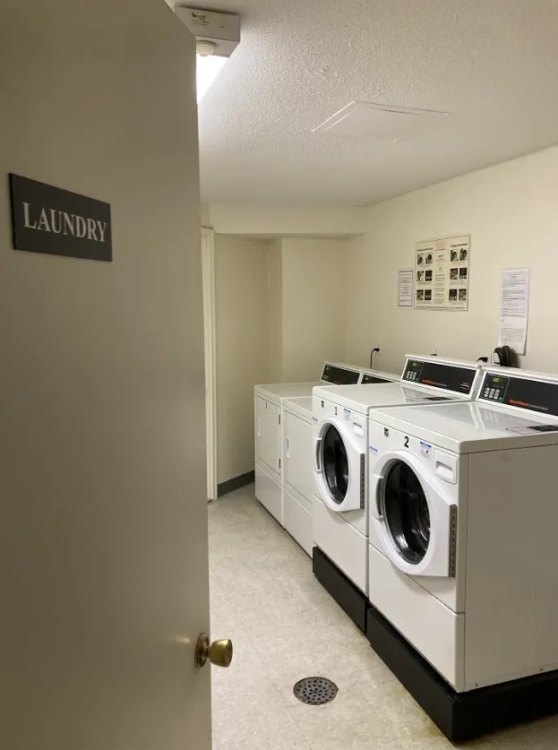 A shared laundry room in an apartment building