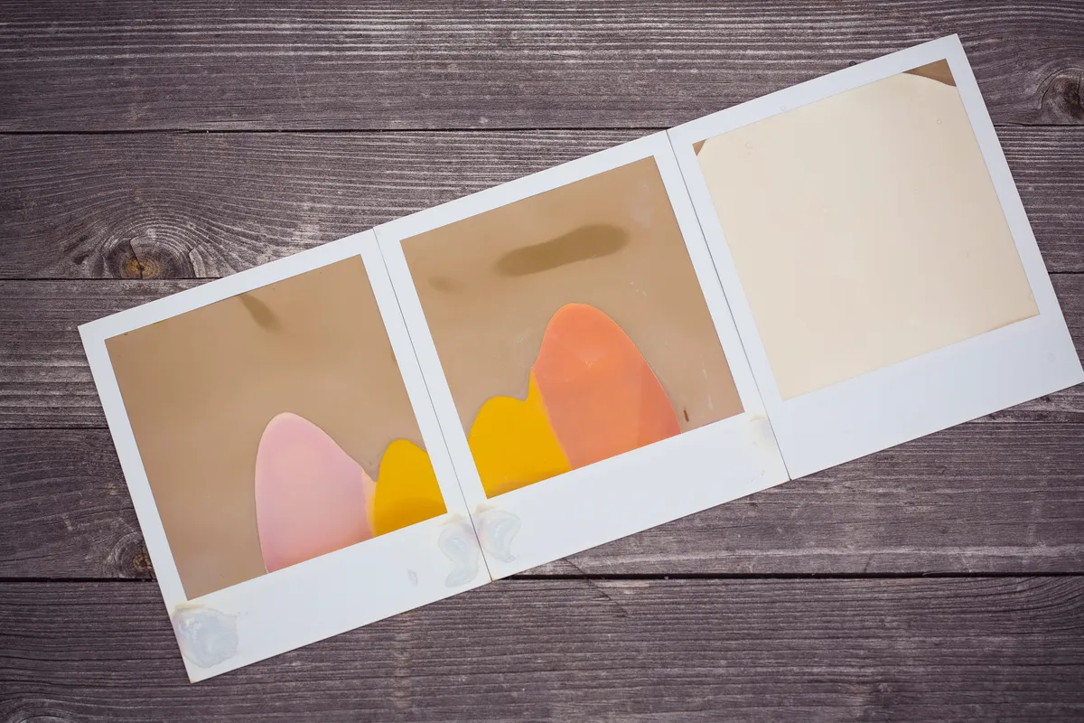 An instant camera resting on a surface