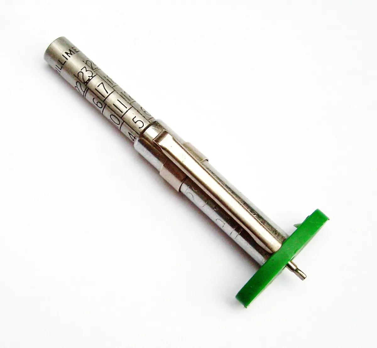 A tread depth gauge measuring a tyre groove