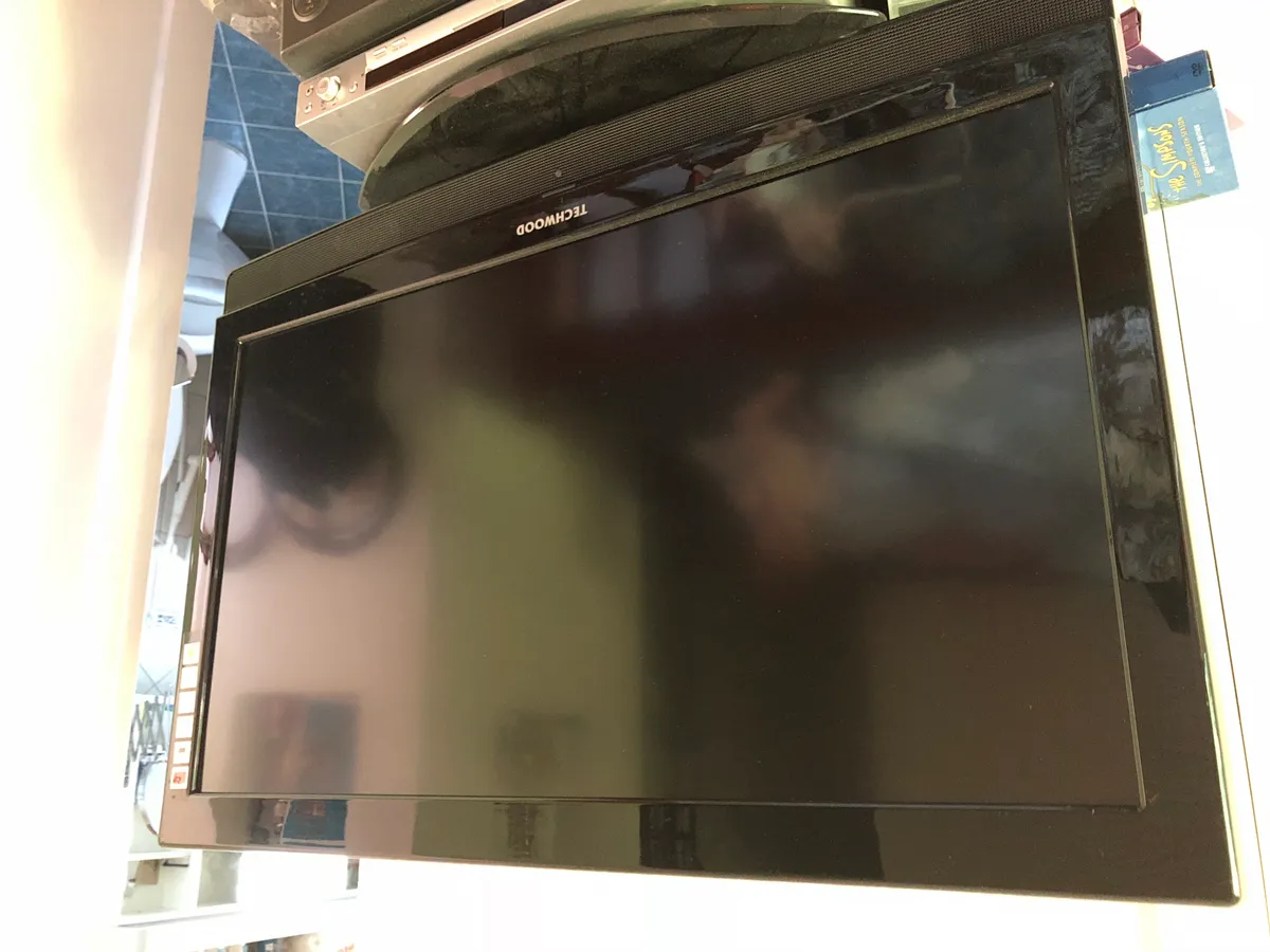 A television on a stand in a room