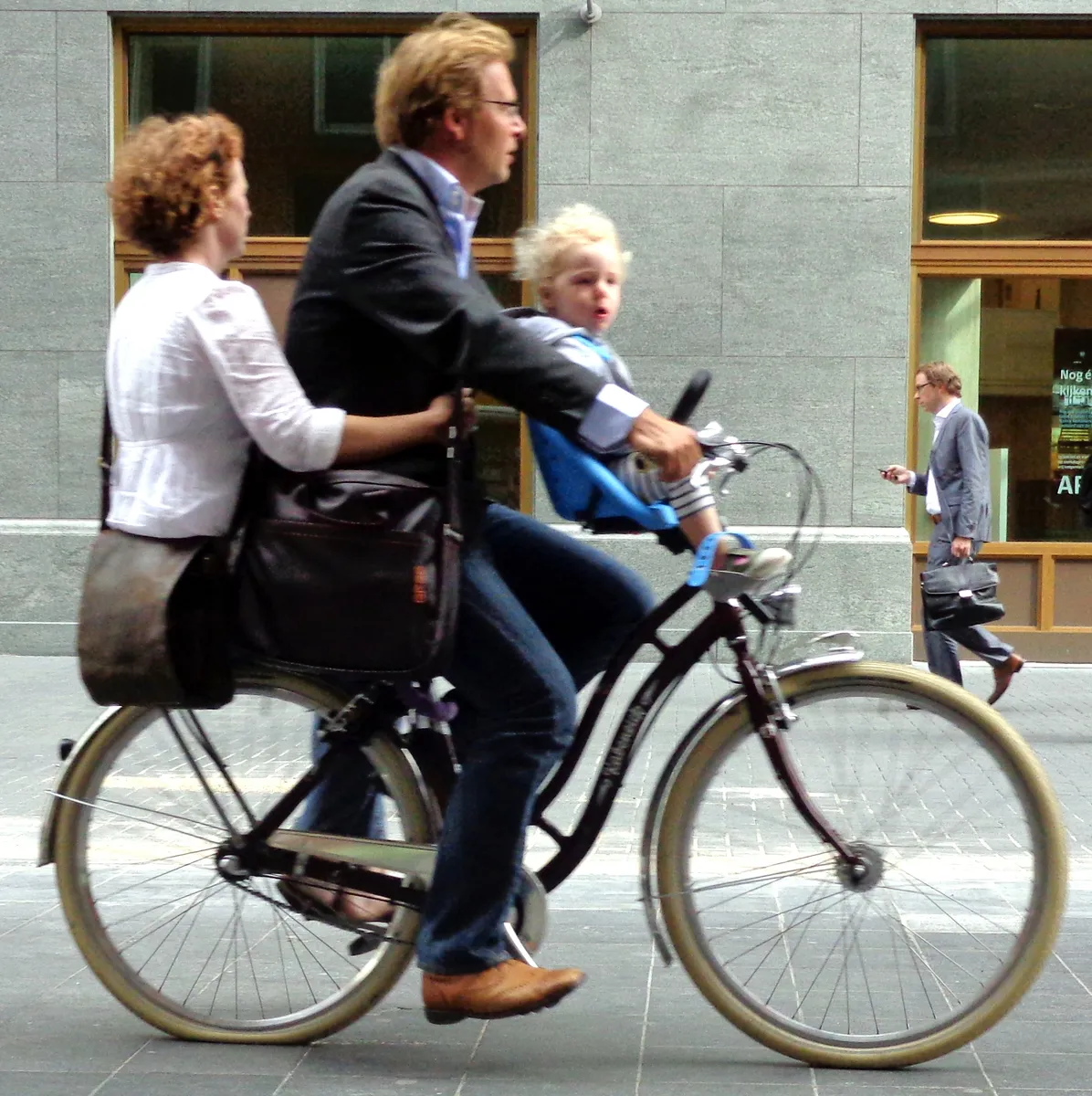 A city bicycle with mudguards and a rack