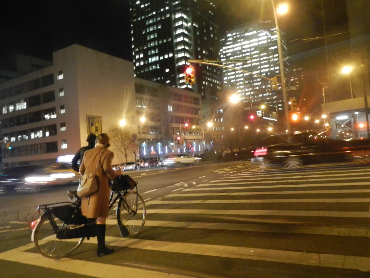Cyclists riding at night with lights