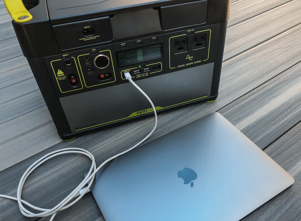 A large portable power station powering a laptop over USB-C