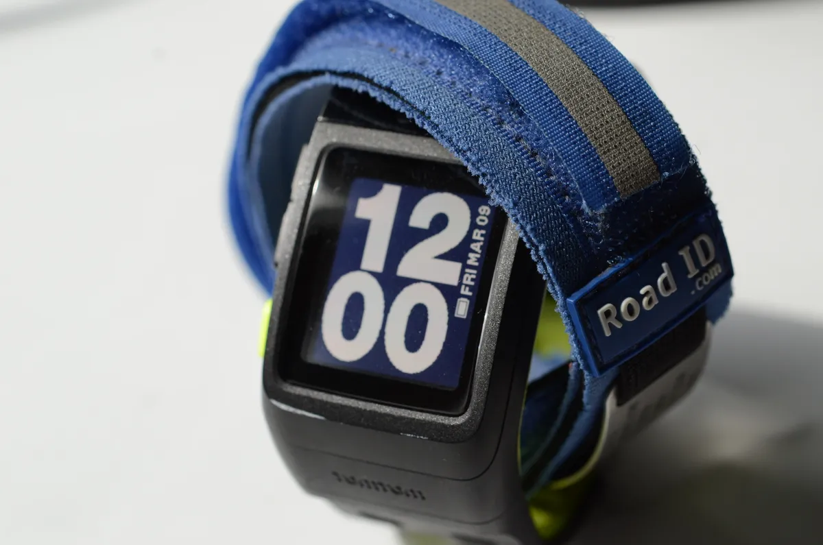 A GPS sports watch alongside running gear