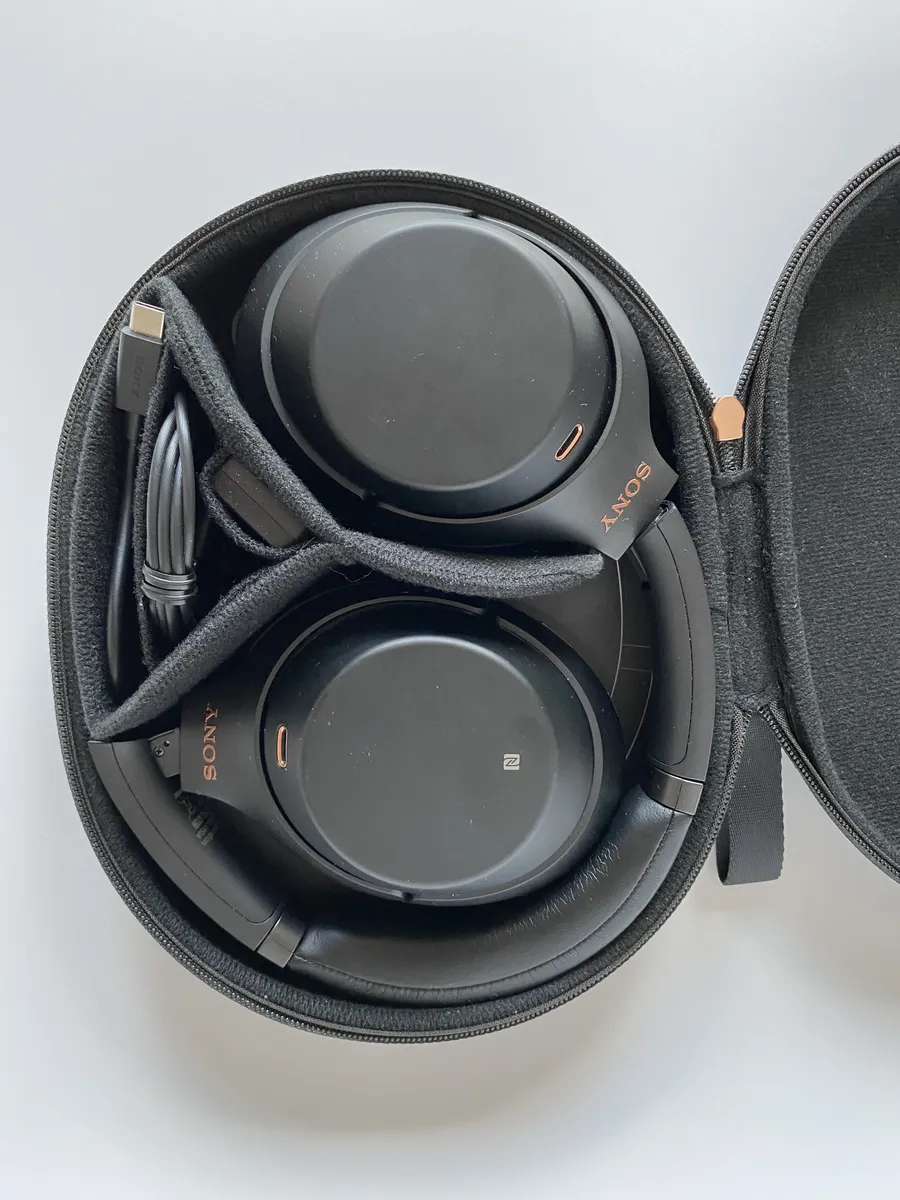 Close-up of the earcup and headband hinge on a Sony WH-1000X series noise-cancelling headphone