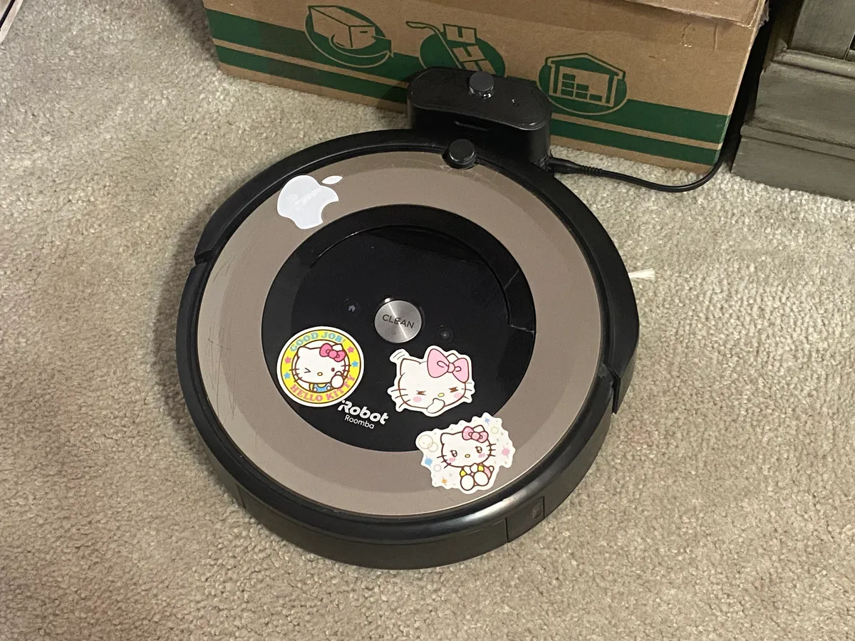 Roomba robot vacuum docked and charging at its base station