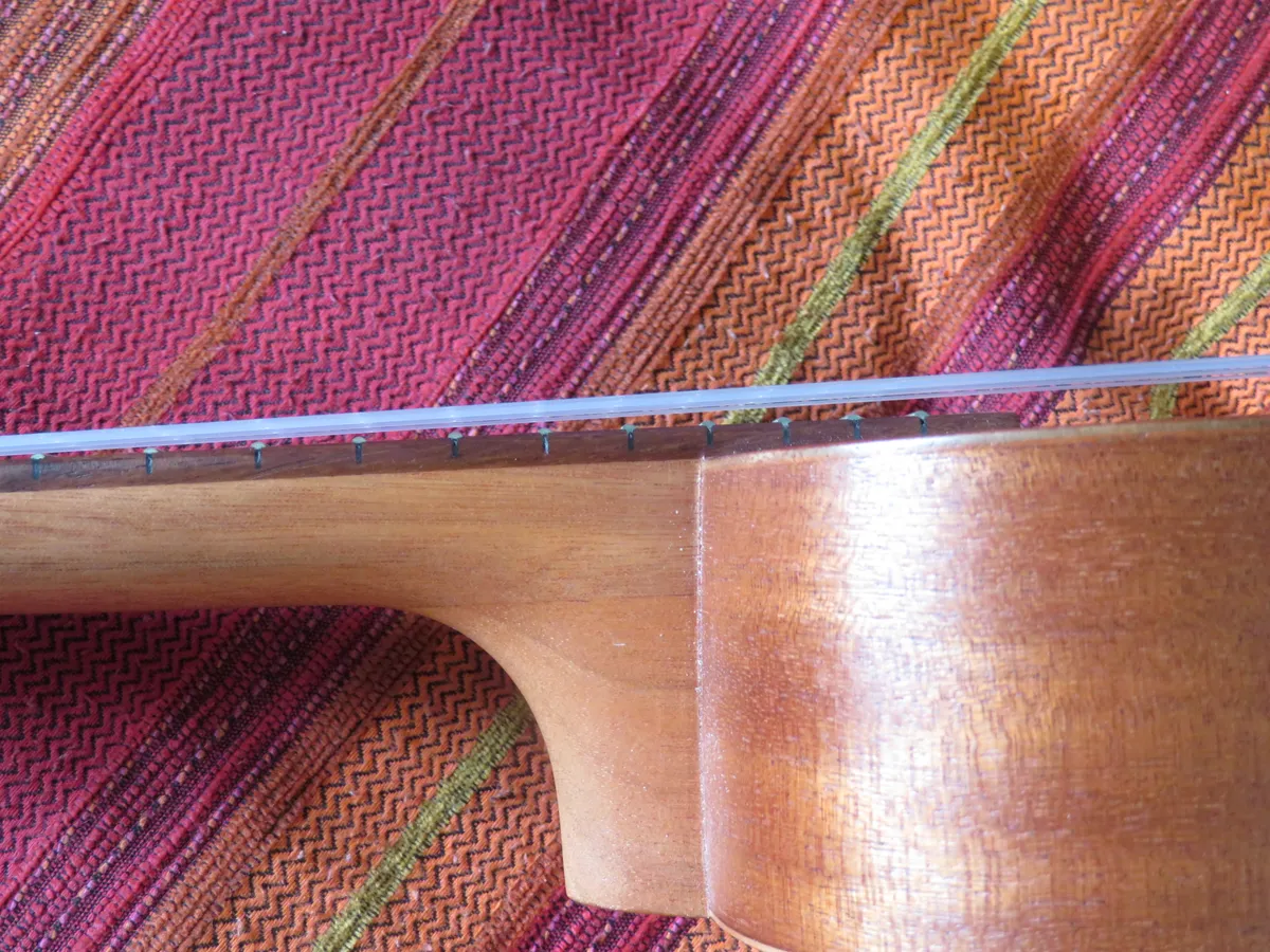 Detail of a soprano ukulele neck and fretboard