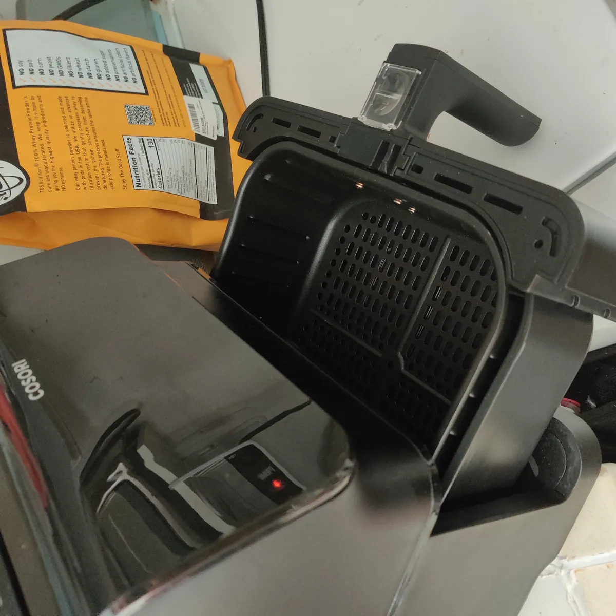 Air fryer basket and crisper plate removed from the unit