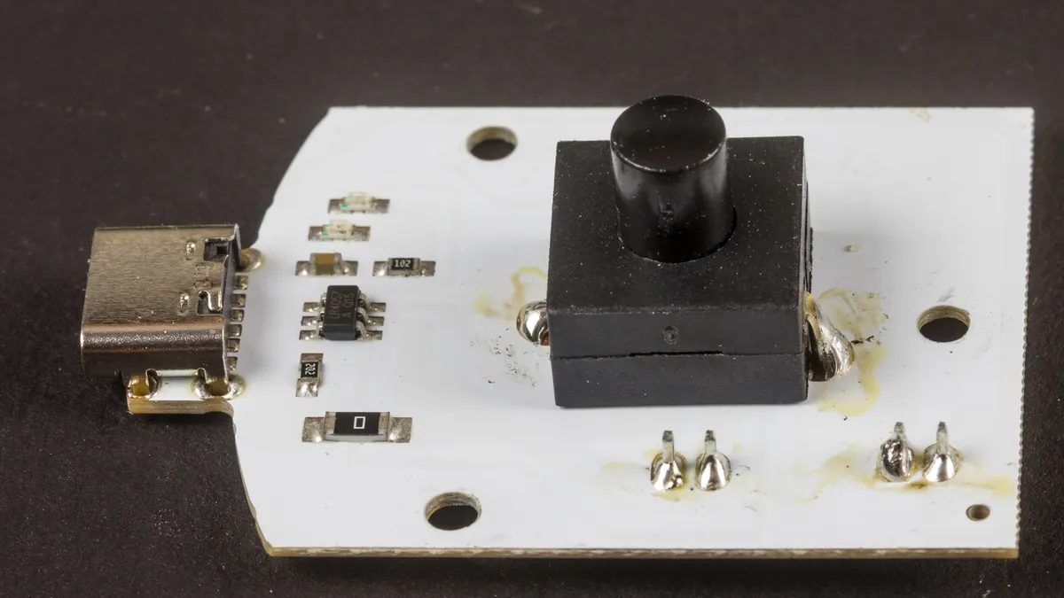 Internal board of an LED desk lamp showing the USB port and switch