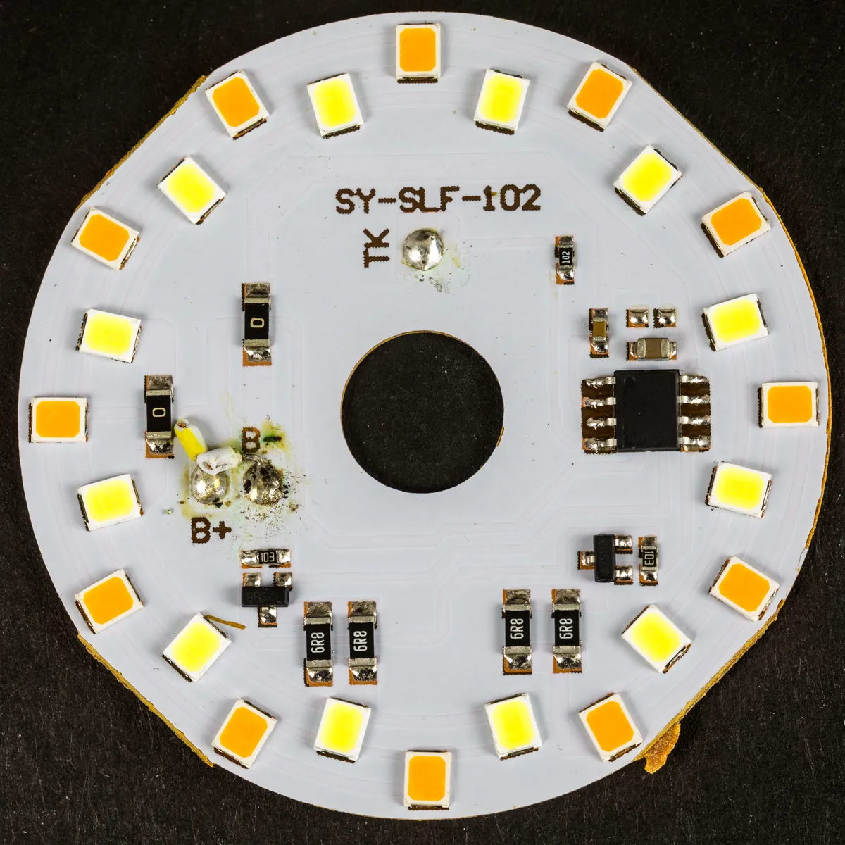 LED board from inside a desk lamp showing surface-mount emitters