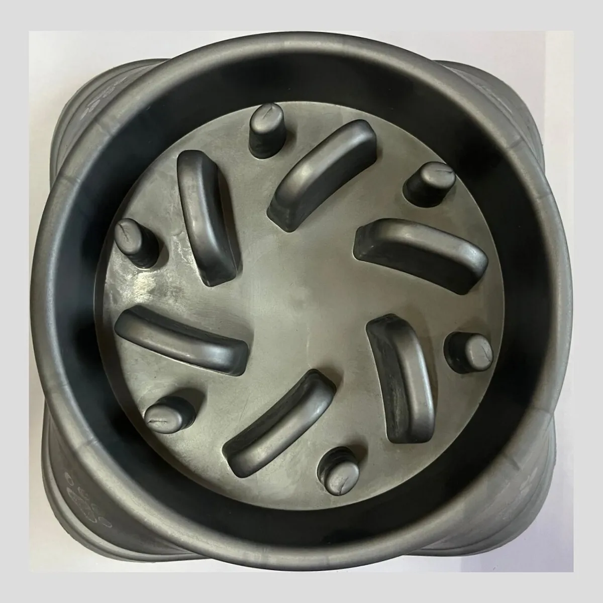 Slow-feeder pet bowl with a maze pattern to slow eating pace