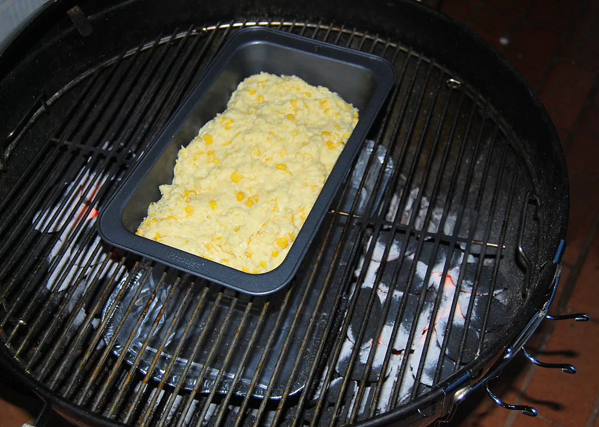 Bread baked in a covered pot on a Weber kettle, using the lid as an oven