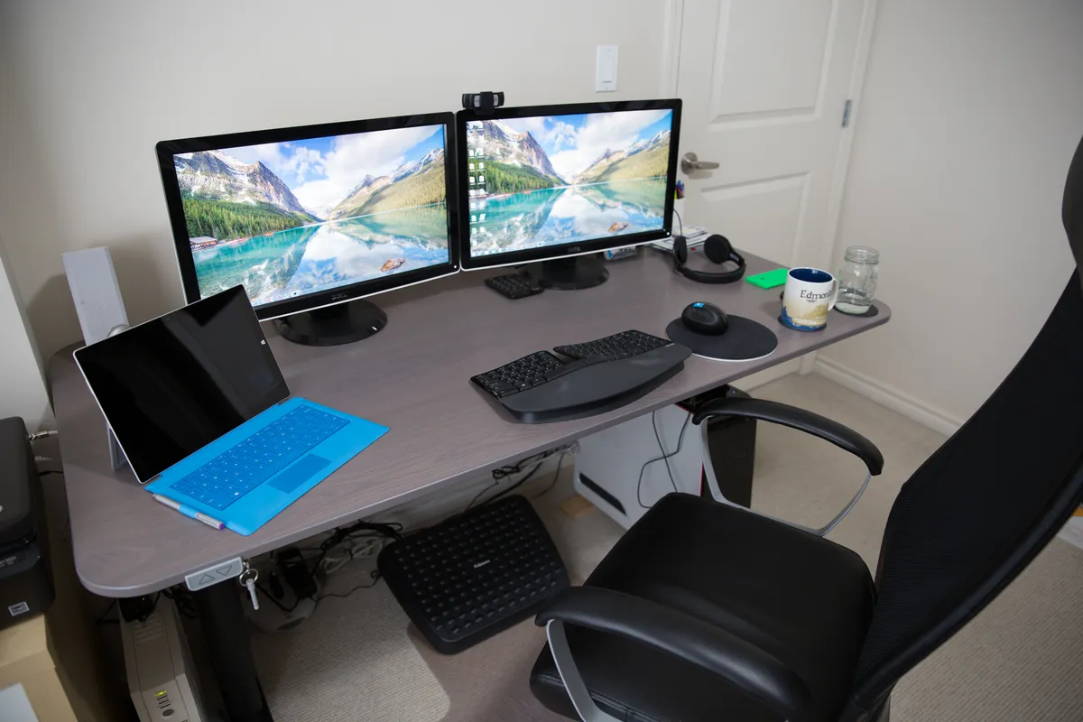Adjustable height desk in a lowered seated position
