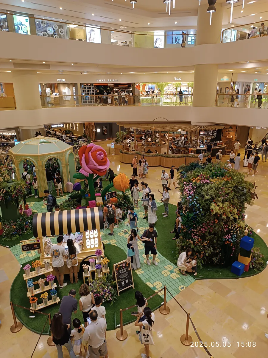 LEGO toy exhibition display with botanical and flower-themed builds
